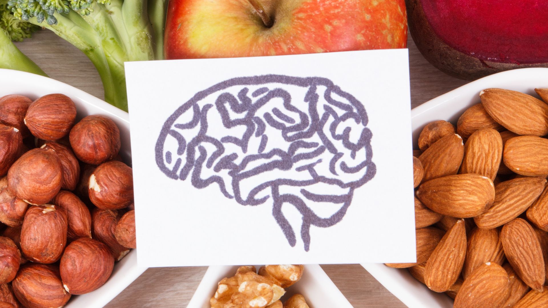 brain graphic over healthy foods