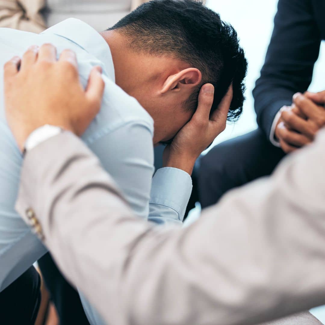 comforting a sad man