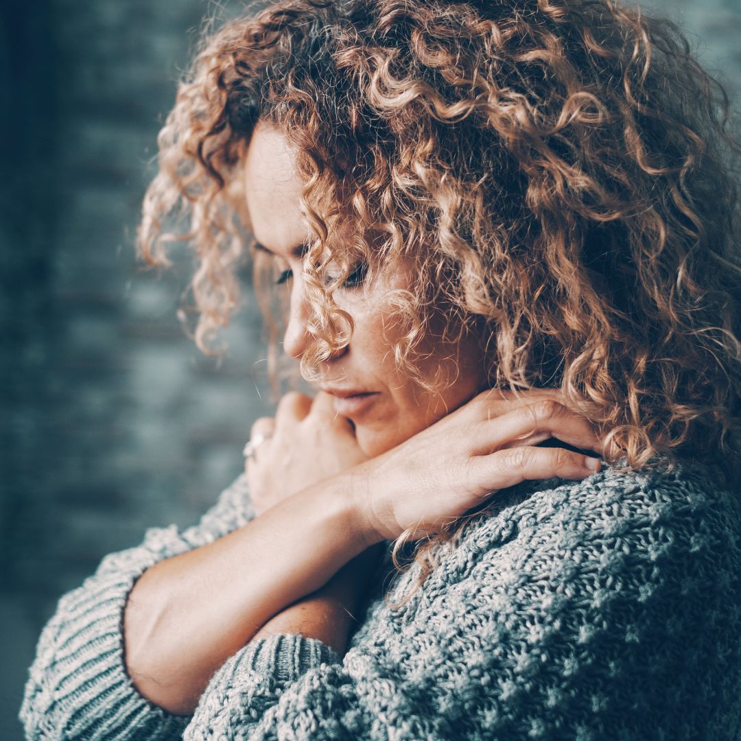 woman with her arms folded across her chest