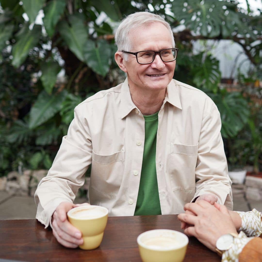 man smiling with drink