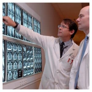 Doctors analyzing brain scans