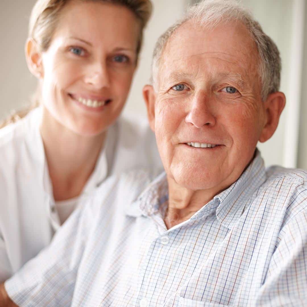 Smiling woman and senior man
