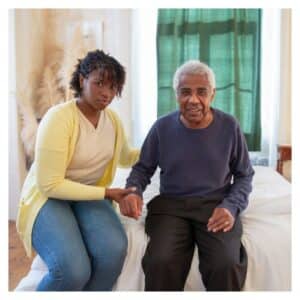 a woman helping an Alzheimer's patient