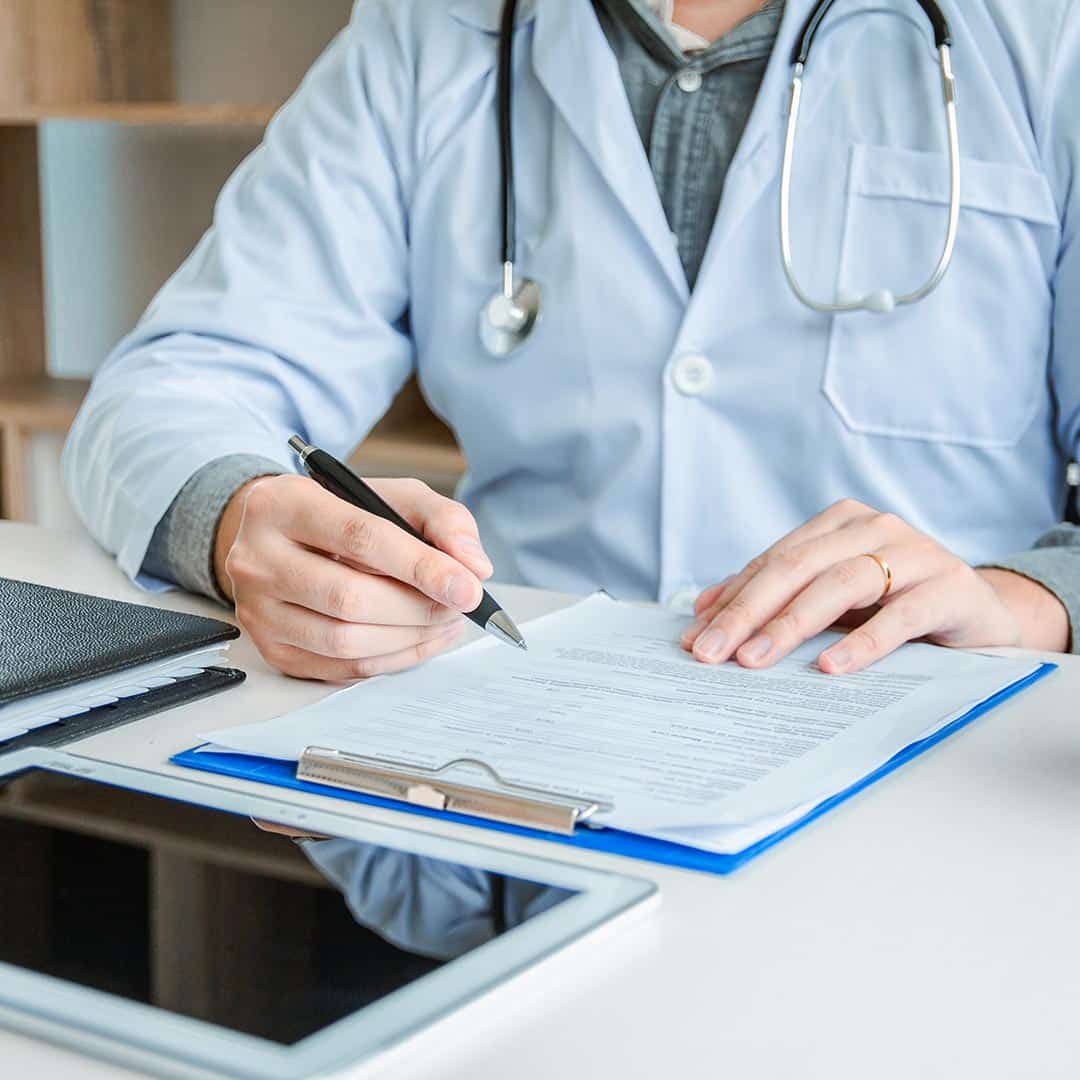 Doctor looking over medical record