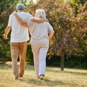 elderly couple walking together
