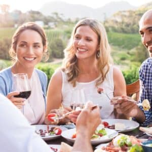 people smiling while at a healthy dinner