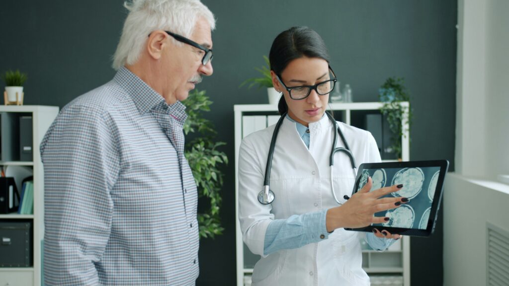 Doctor showing patient results to his Memory Assessment 
